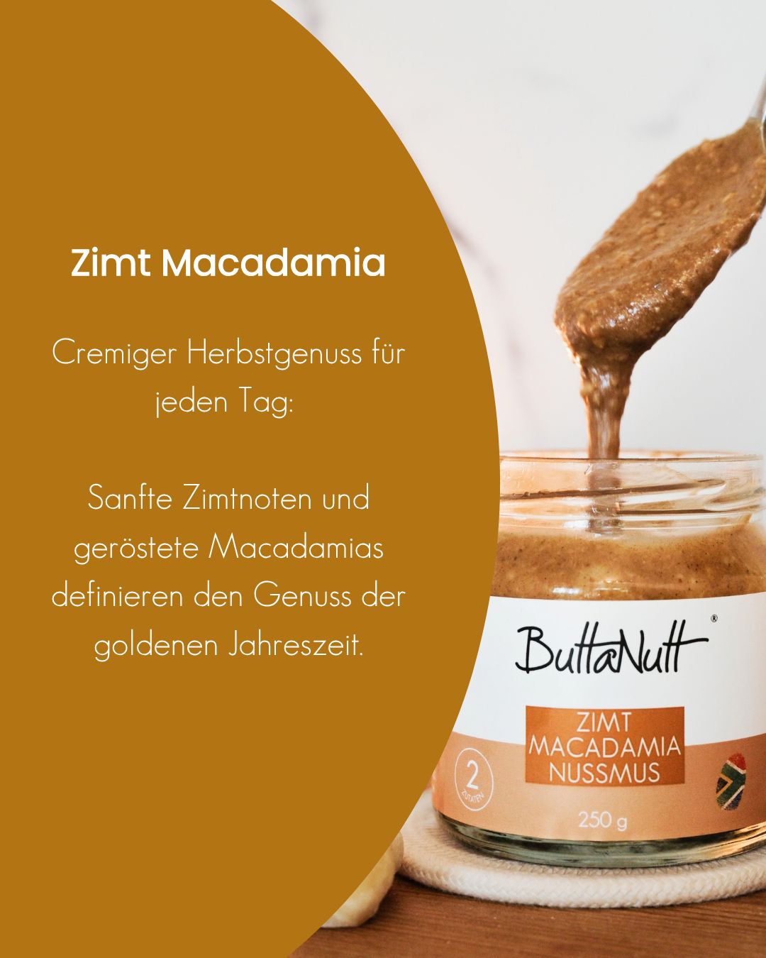 Löffel mit cremigem Zimt Macadamia Nussmus von ButtaNutt über dem offenen 250-g-Glas